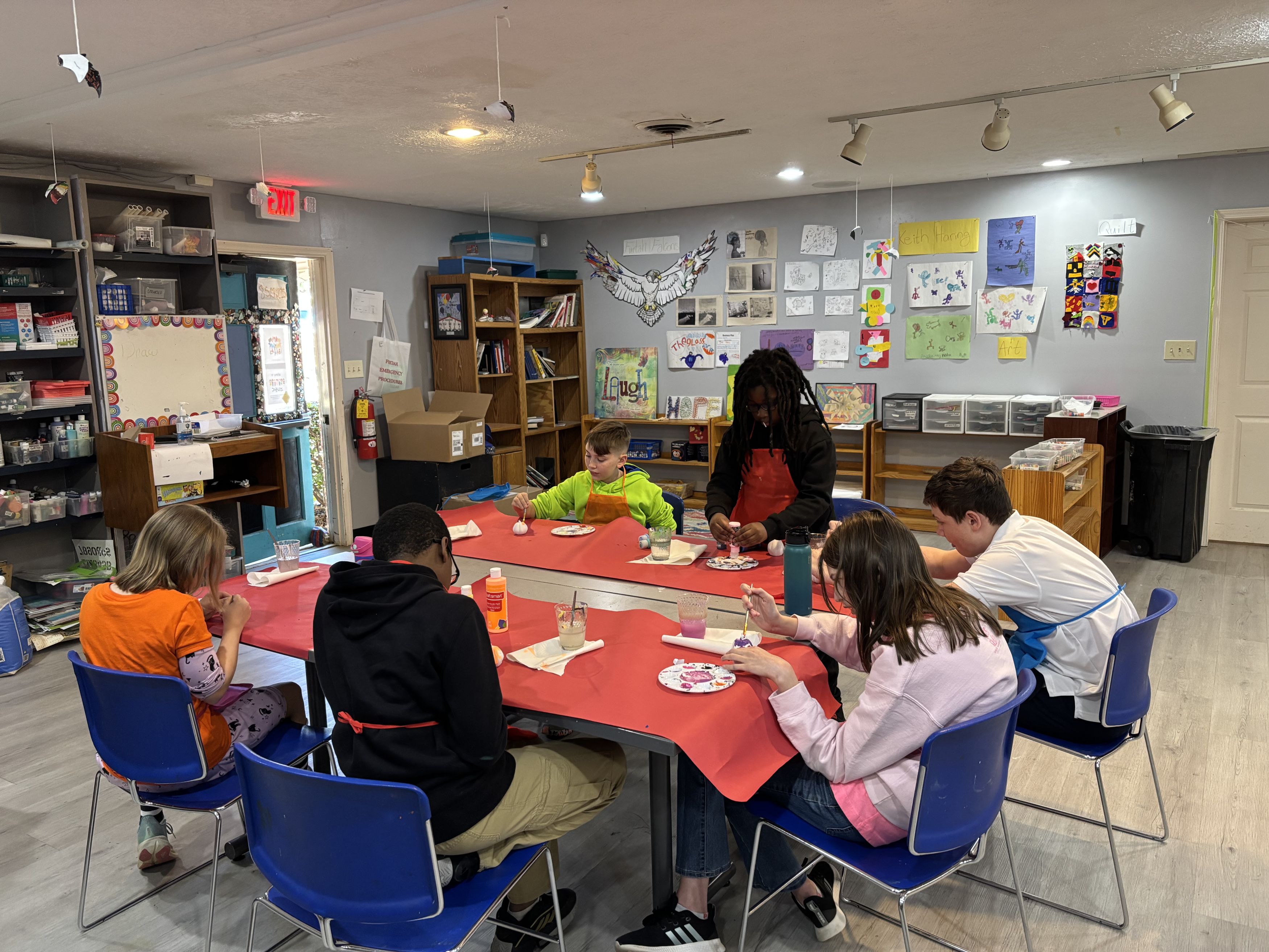 student group painting in art