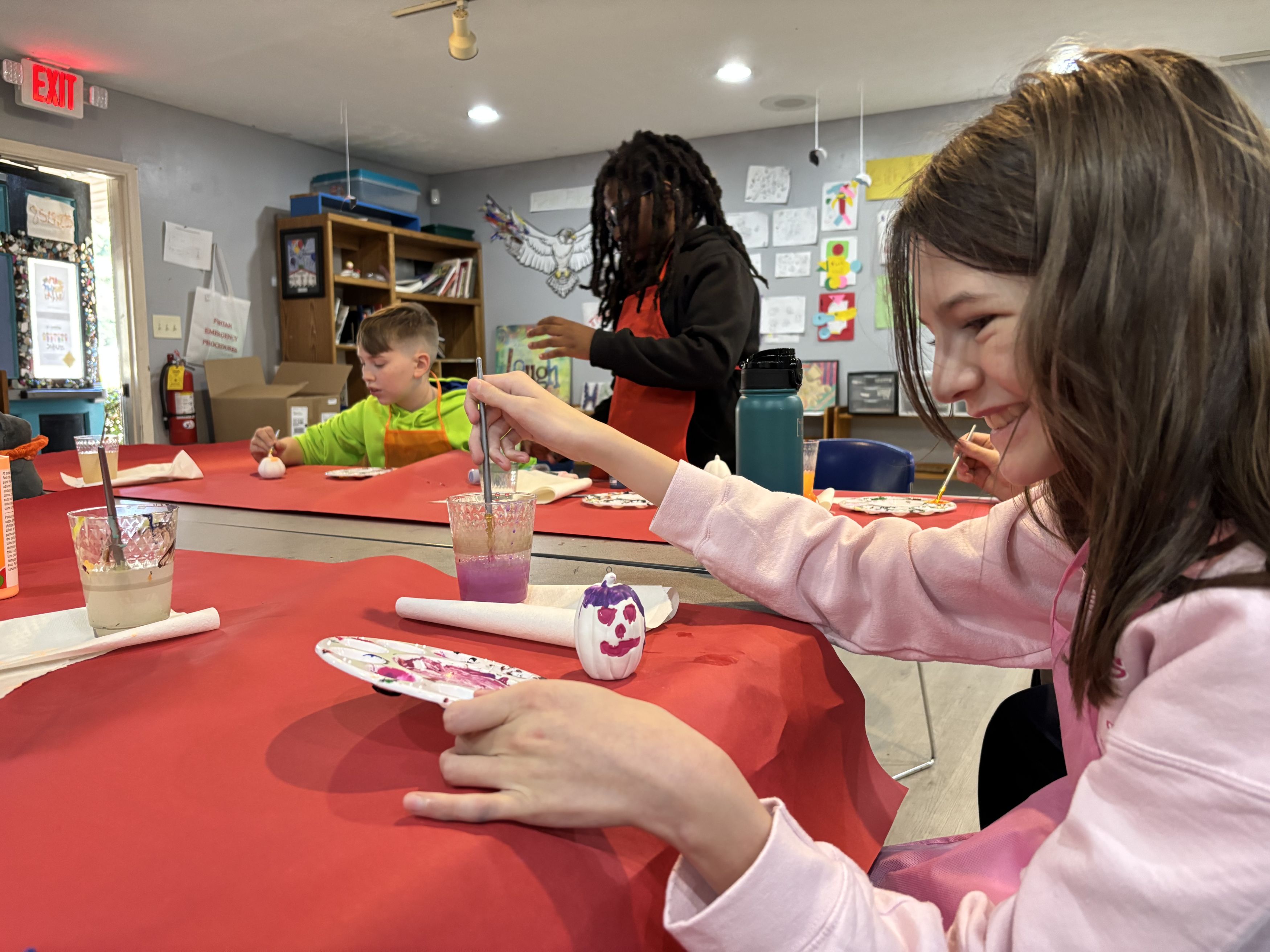 happy student mixing paints